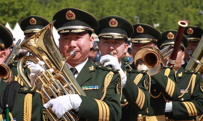8 countries take part in military band parade at Beijing Olympic Park