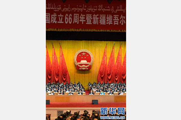 10月1日，慶祝中華人民共和國成立66周年暨新疆維吾爾自治區(qū)成立60周年大會在新疆人民會堂隆重舉行。 新華社記者 高潔 攝 